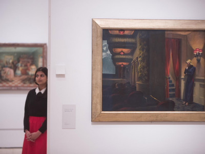 Installation image of ‘America after the Fall: Painting in the 1930s’ at the Royal Academy of Arts, London, showing 'New York Movie' by Edward Hopper